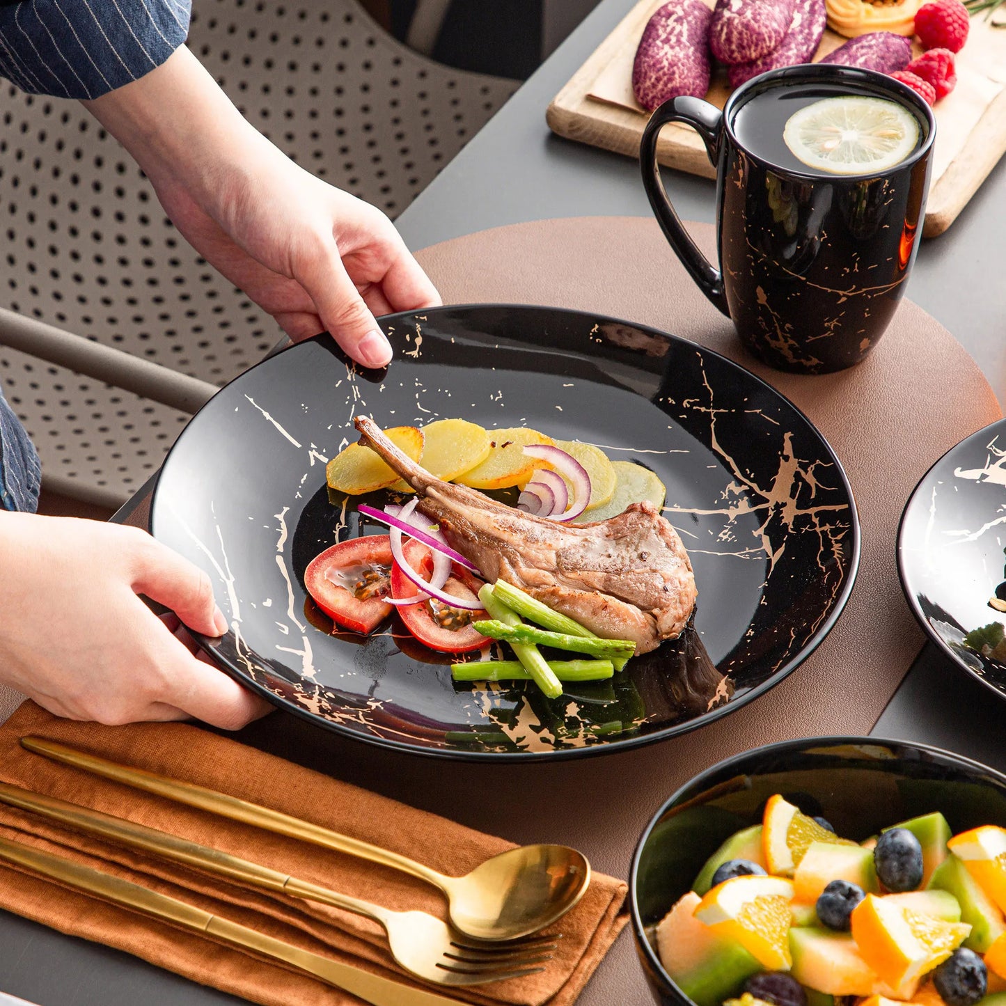Black Porcelain Dinnerware Set with Elegant Gold Splash Design