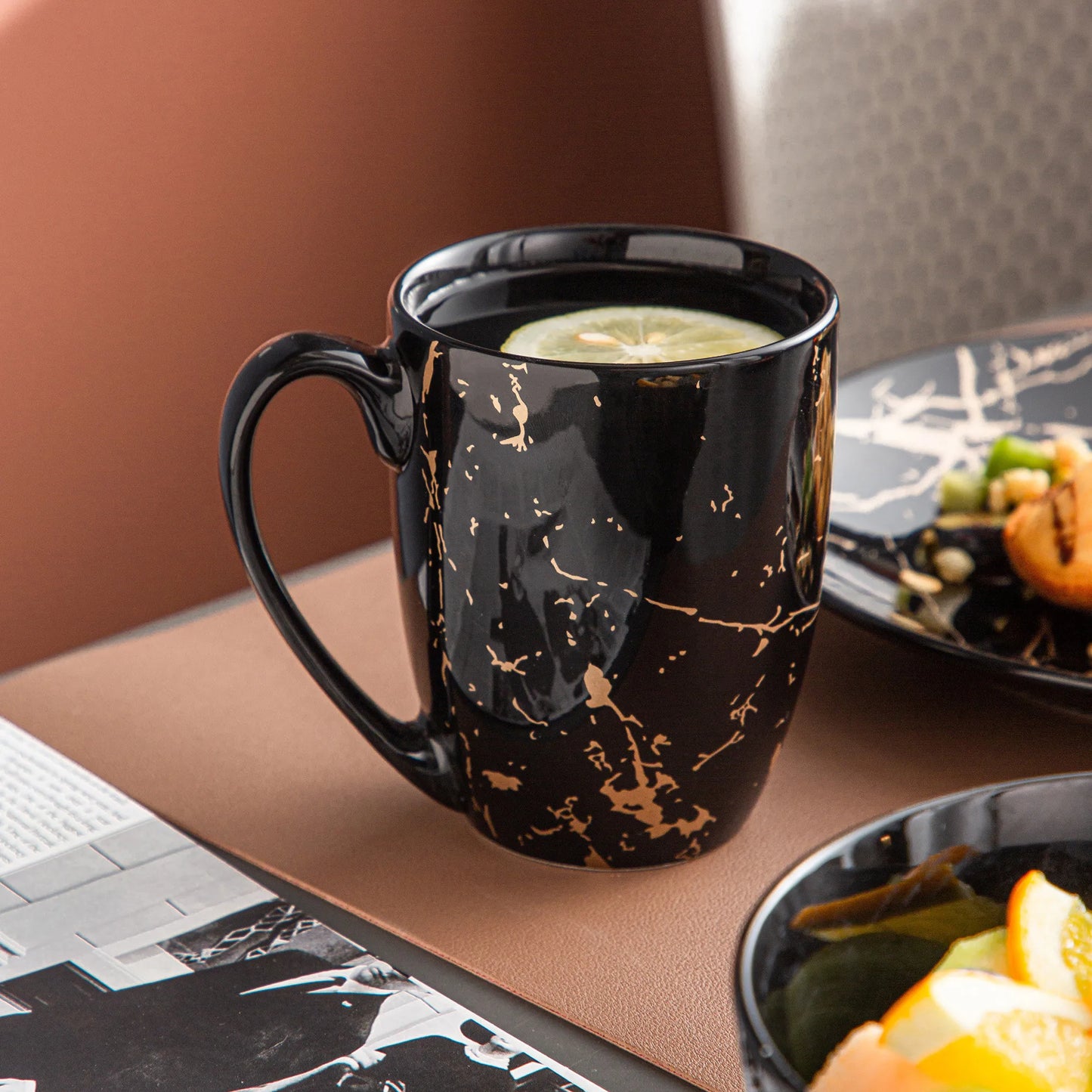 Black Porcelain Dinnerware Set with Elegant Gold Splash Design