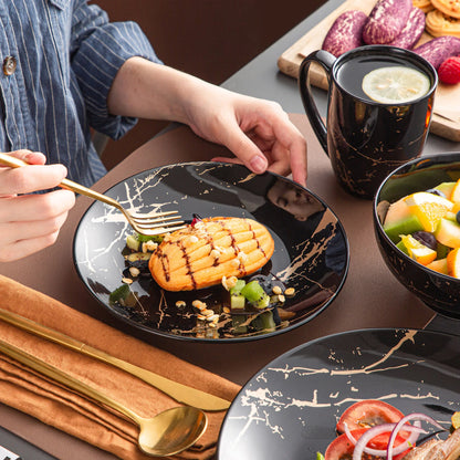 Black Porcelain Dinnerware Set with Elegant Gold Splash Design